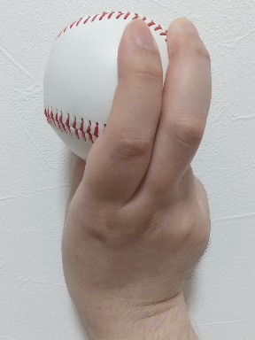 背面から見たスイーパーの握り方